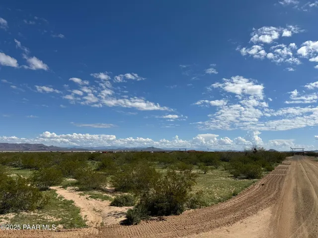 a view of a lake with sunset
