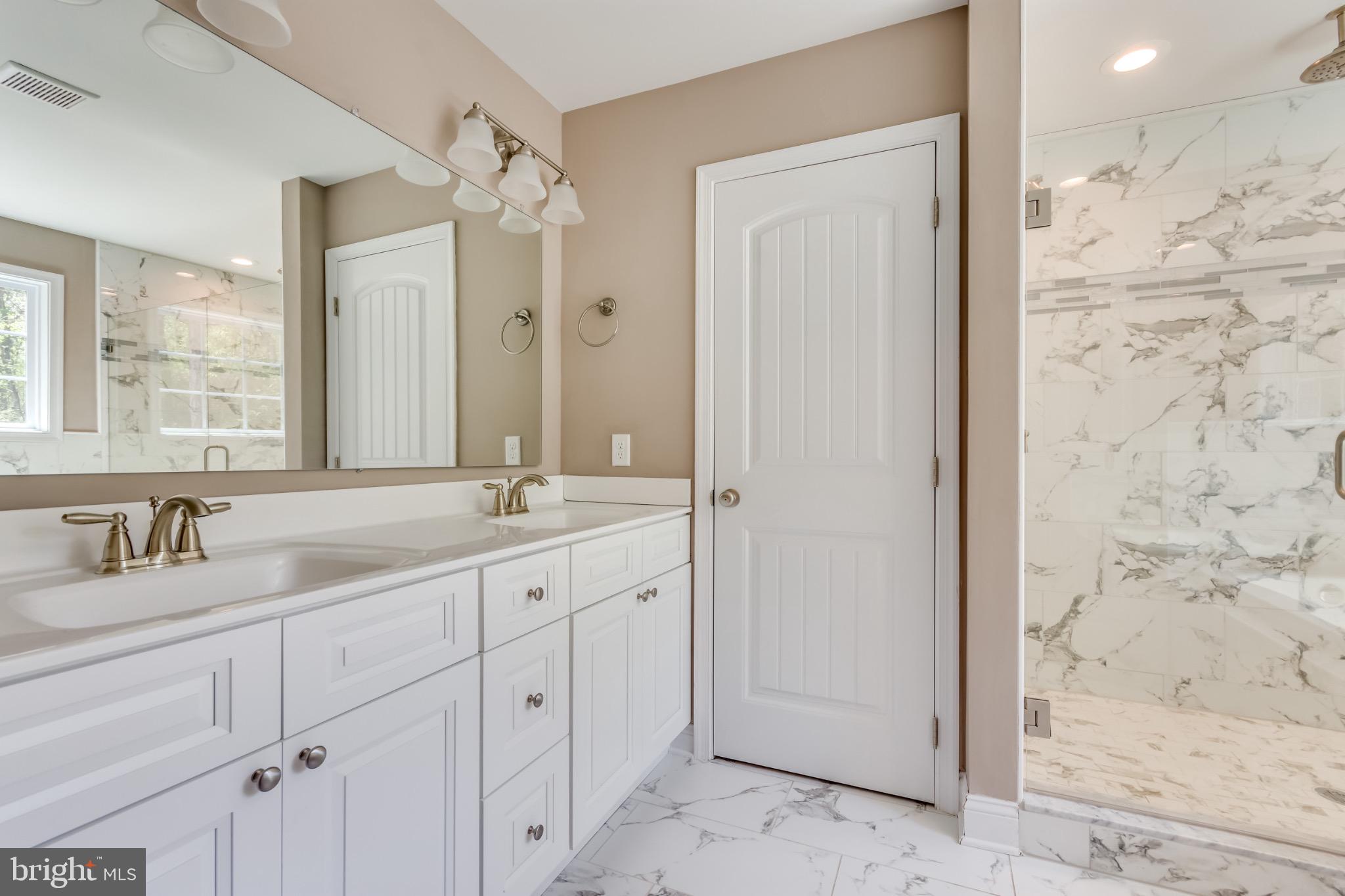 1 Libby's Ridge Road Berkeley Springs, WV 25411 - Photo 26 of 31 a bathroom with a granite countertop sink mirror and double