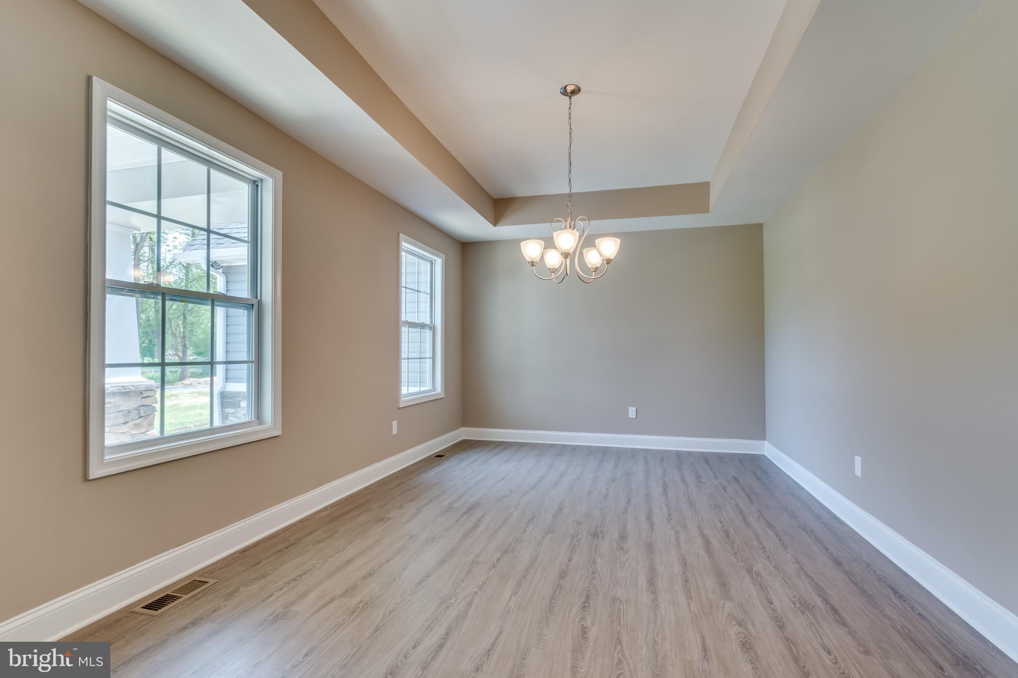 1 Libby's Ridge Road Berkeley Springs, WV 25411 - Photo 6 of 31 wooden floor in an empty room with a window