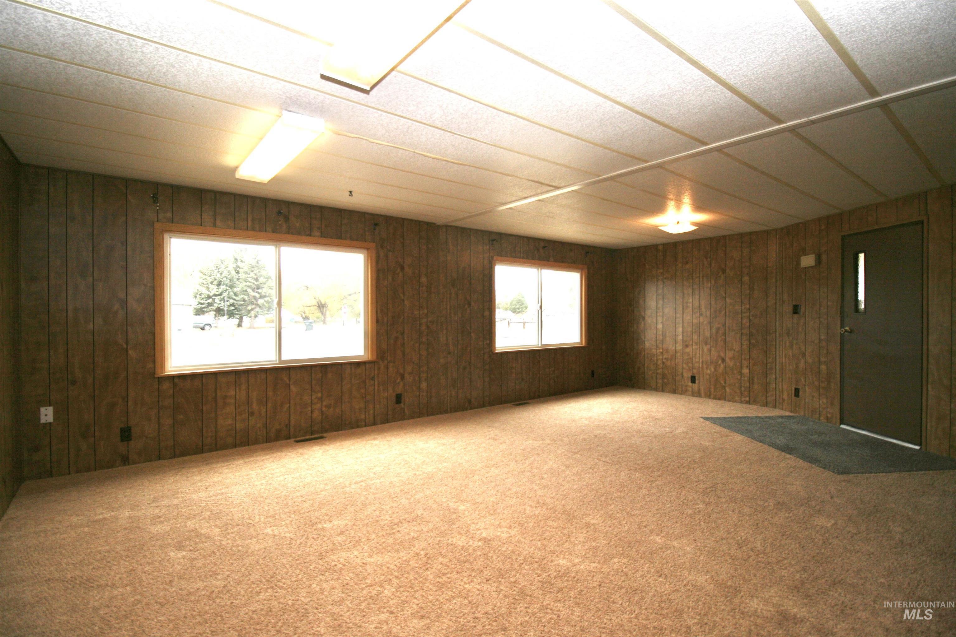 500 Somerville Street Jordan Valley, OR 97910 - Photo 27 of 35 Unfurnished room featuring carpet and wood walls