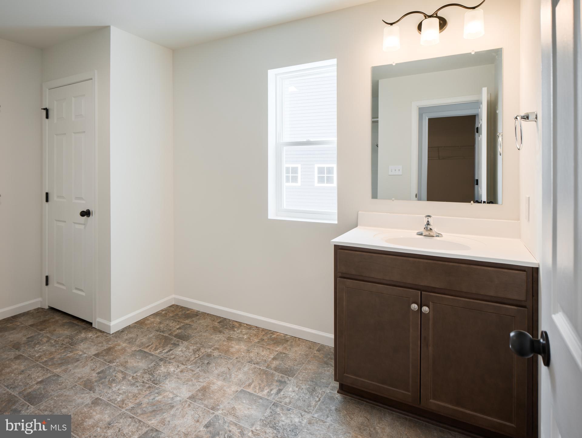 415 Little Walnut Court Windsor, PA 17366 - Photo 11 of 53 a bathroom with a sink vanity and a mirror