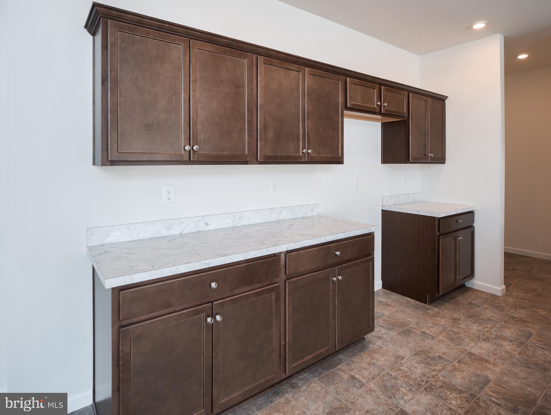 415 Little Walnut Court Windsor, PA 17366 - Photo 27 of 53 a view of cabinets with wooden floor