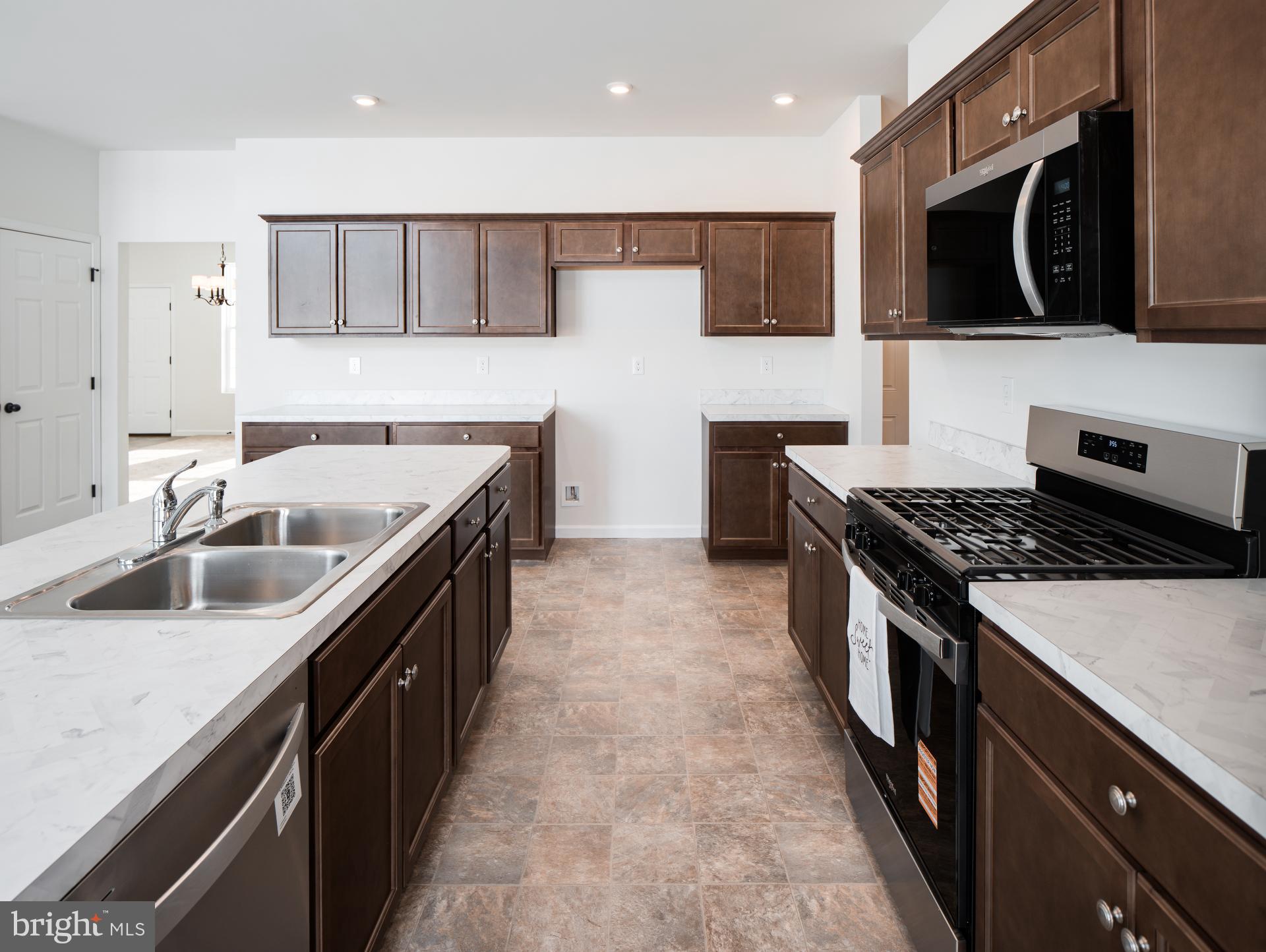 415 Little Walnut Court Windsor, PA 17366 - Photo 28 of 53 a kitchen with stainless steel appliances granite countertop a sink and a stove