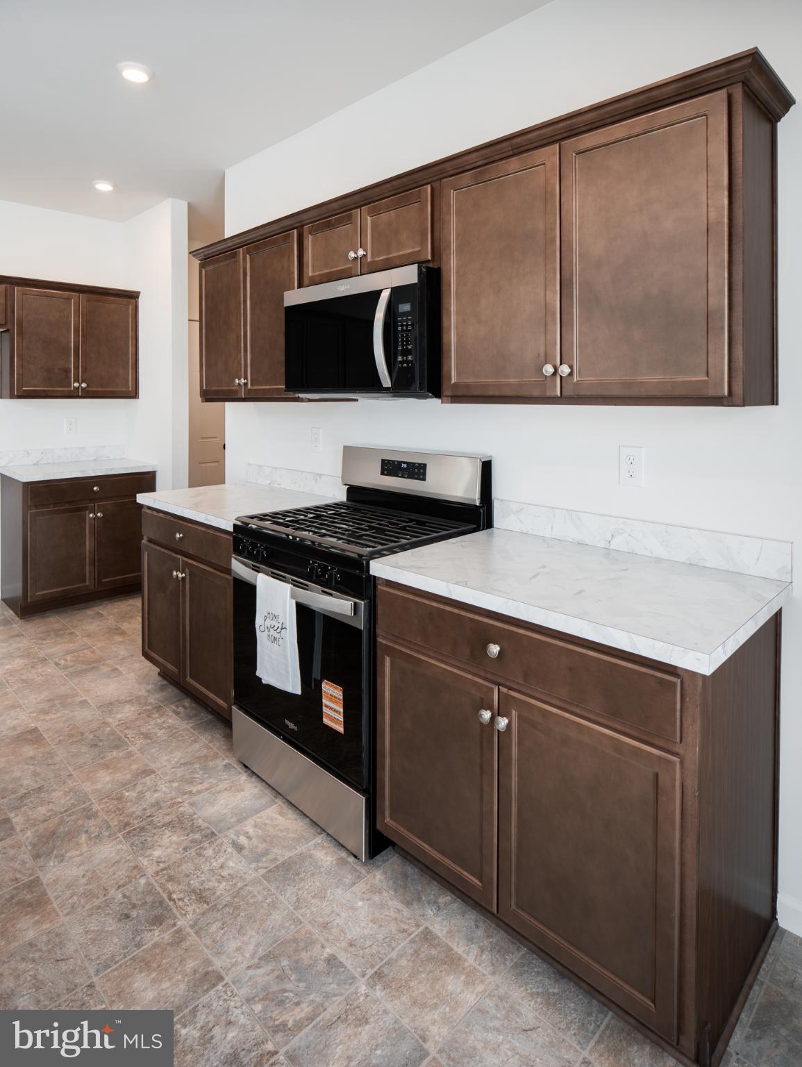415 Little Walnut Court Windsor, PA 17366 - Photo 29 of 53 a kitchen with stainless steel appliances a stove microwave and sink