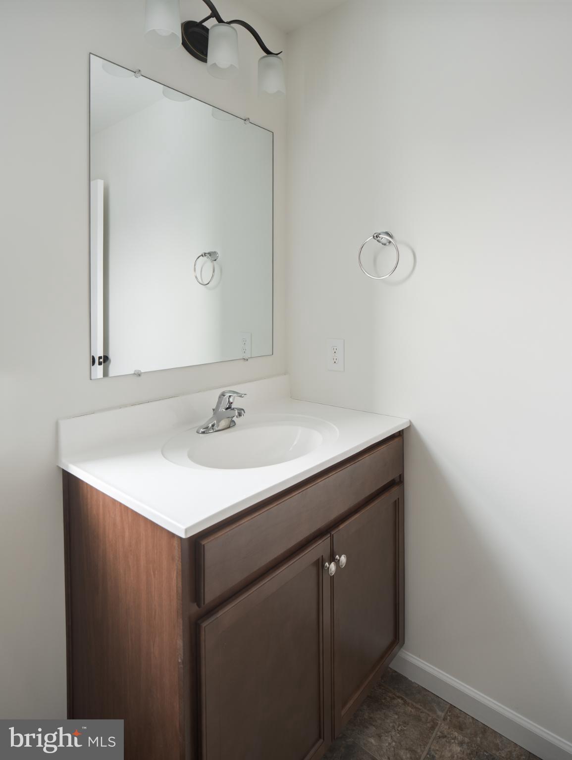 415 Little Walnut Court Windsor, PA 17366 - Photo 36 of 53 a bathroom with a sink vanity and a mirror