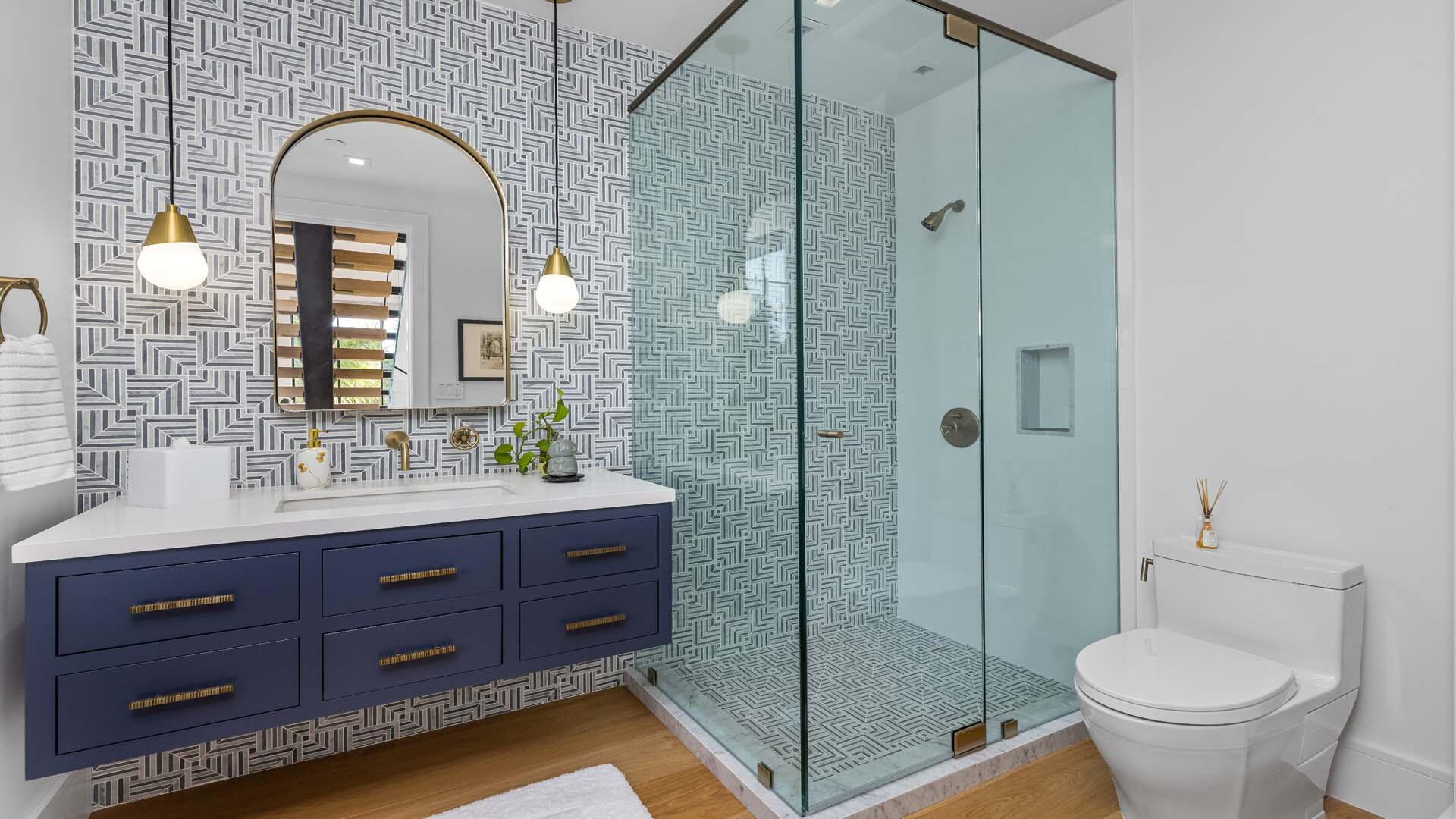 230 George Bush Boulevard Delray Beach, FL 33444 - Photo 23 of 51 a bathroom with a double vanity sink toilet and shower