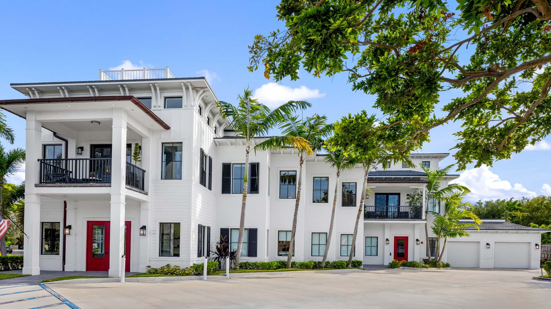 230 George Bush Boulevard Delray Beach, FL 33444 - Photo 3 of 51 a front view of a building with street view
