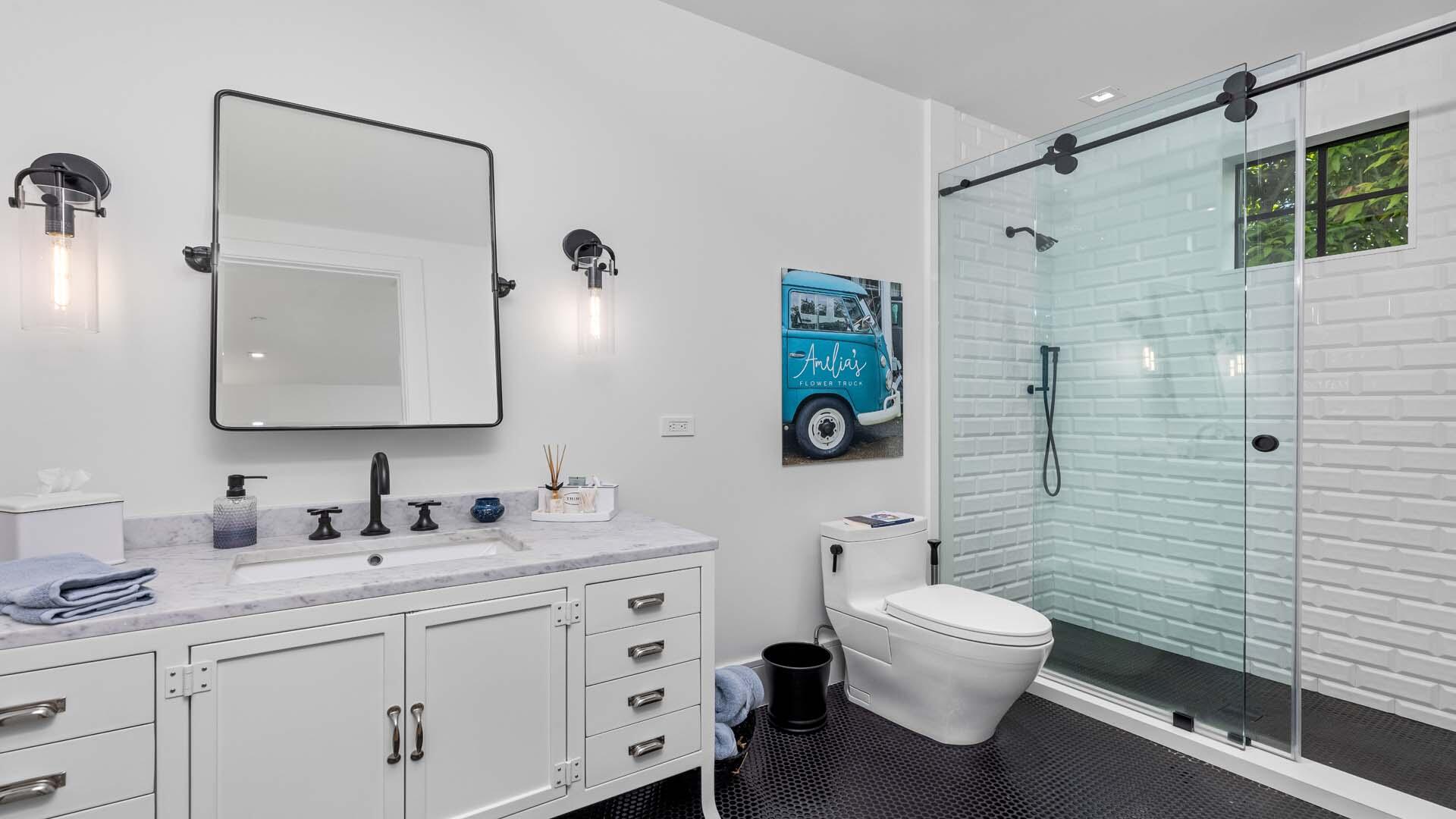 230 George Bush Boulevard Delray Beach, FL 33444 - Photo 31 of 51 a bathroom with a toilet sink and mirror