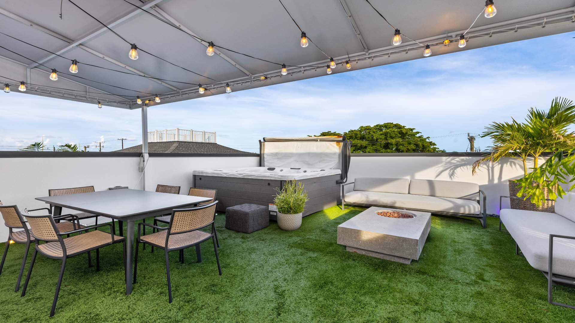 230 George Bush Boulevard Delray Beach, FL 33444 - Photo 33 of 51 a backyard of a house with table and chairs
