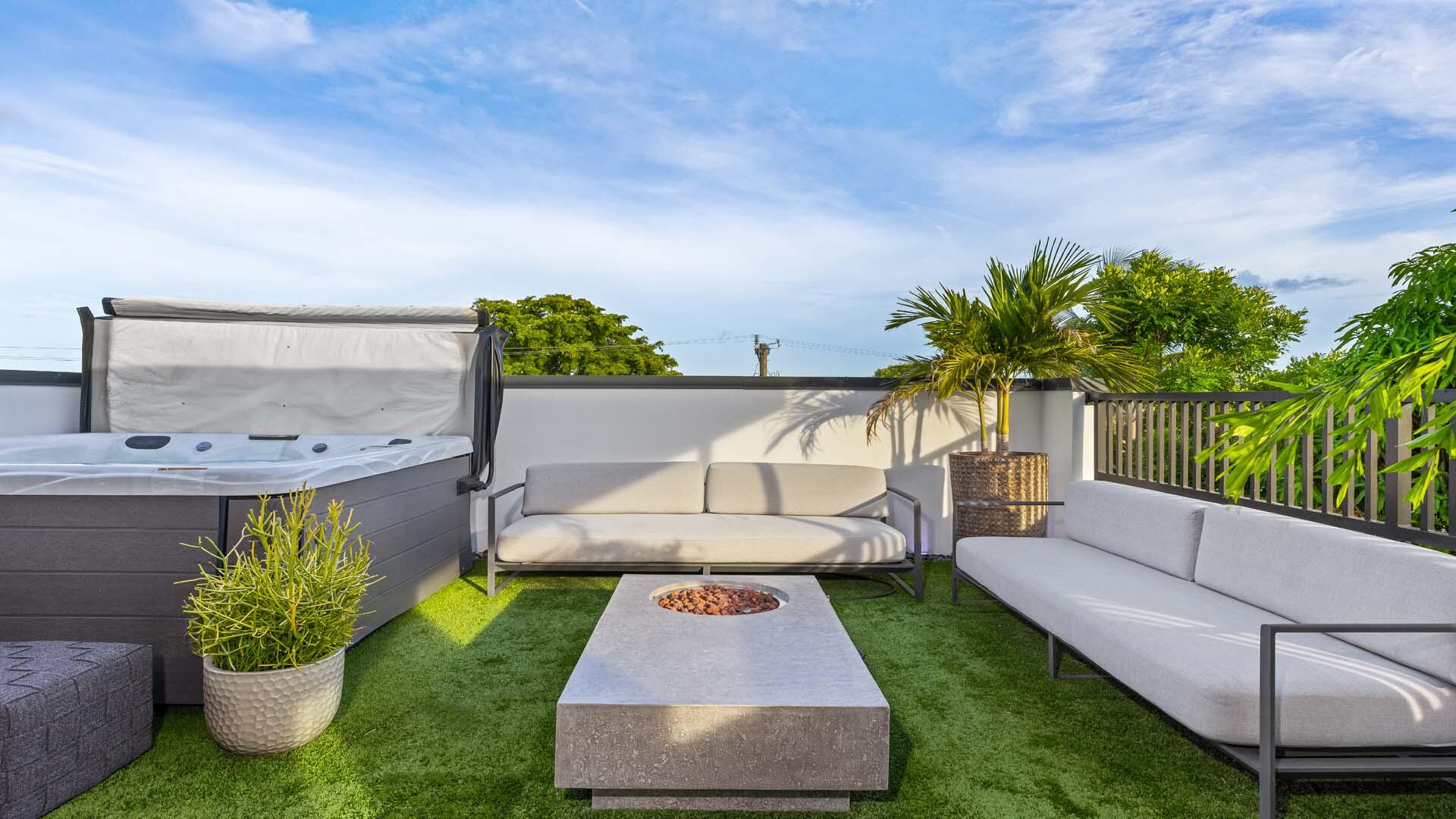 230 George Bush Boulevard Delray Beach, FL 33444 - Photo 37 of 51 a view of a backyard with couches and potted plants
