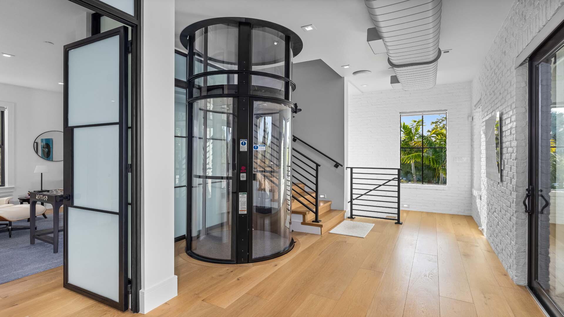 230 George Bush Boulevard Delray Beach, FL 33444 - Photo 6 of 51 a view of entryway and hall with wooden floor