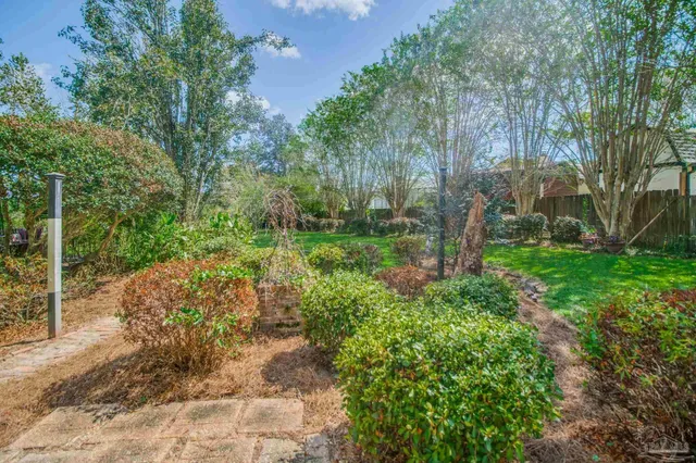 a living room with furniture couches and a table