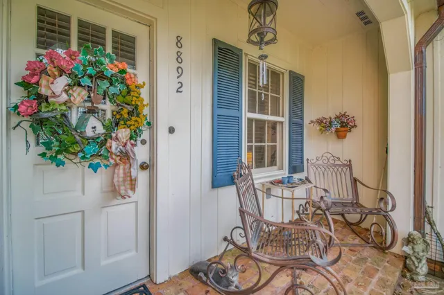 a view of dining room with furniture and wooden floor