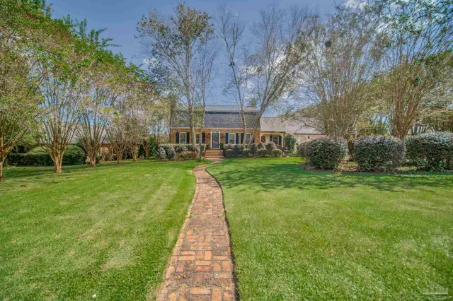 a bathroom with a toilet sink and shower
