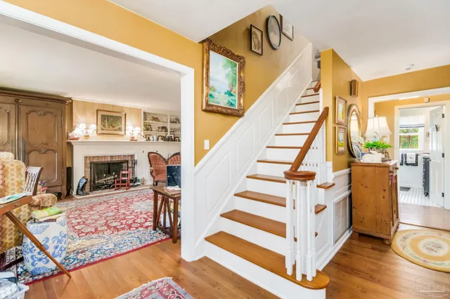 a view of a dining room with furniture and chandelier