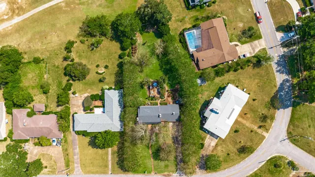 a living room with furniture a rug and a chandelier