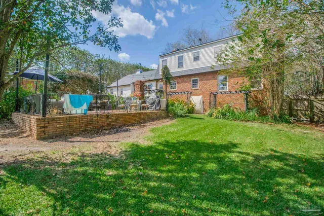 a view of a park with large trees