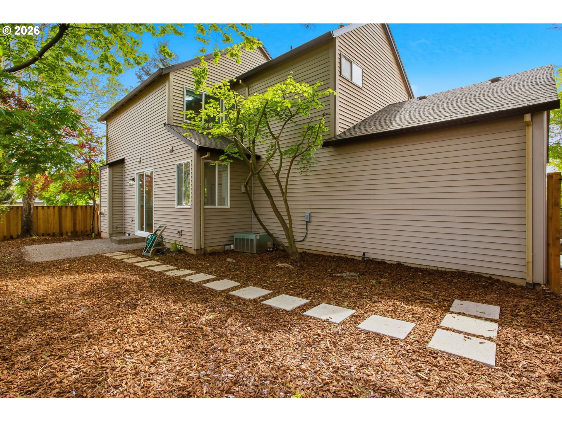 8911 Southwest Gravenstein Lane Tigard, OR 97224 - Photo 32 of 33 a view of a backyard with a house