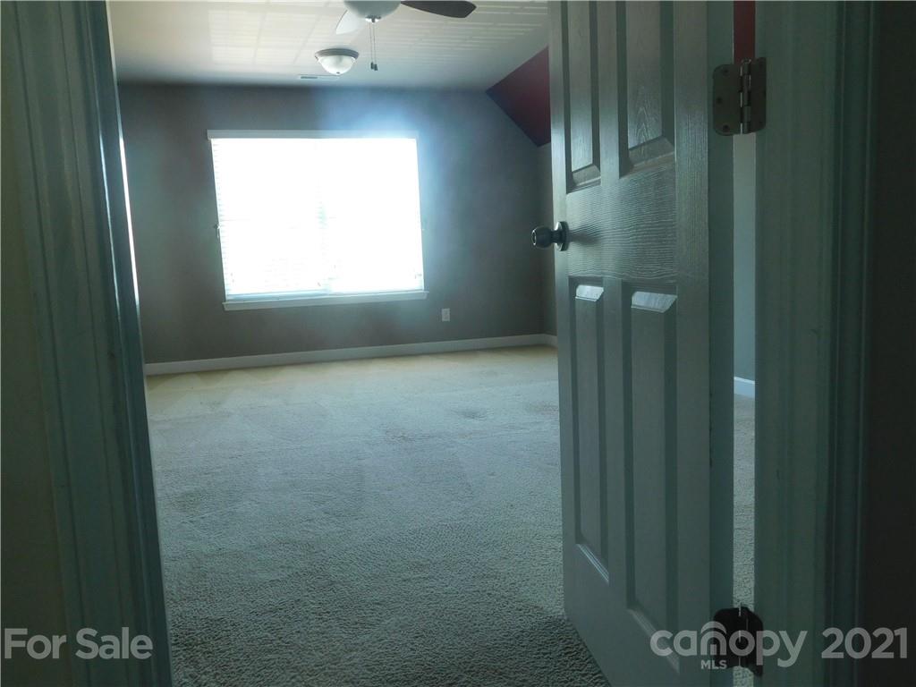 2602 Spring Breeze Way Monroe, NC 28110 - Photo 22 of 43 a view of an empty room with a window