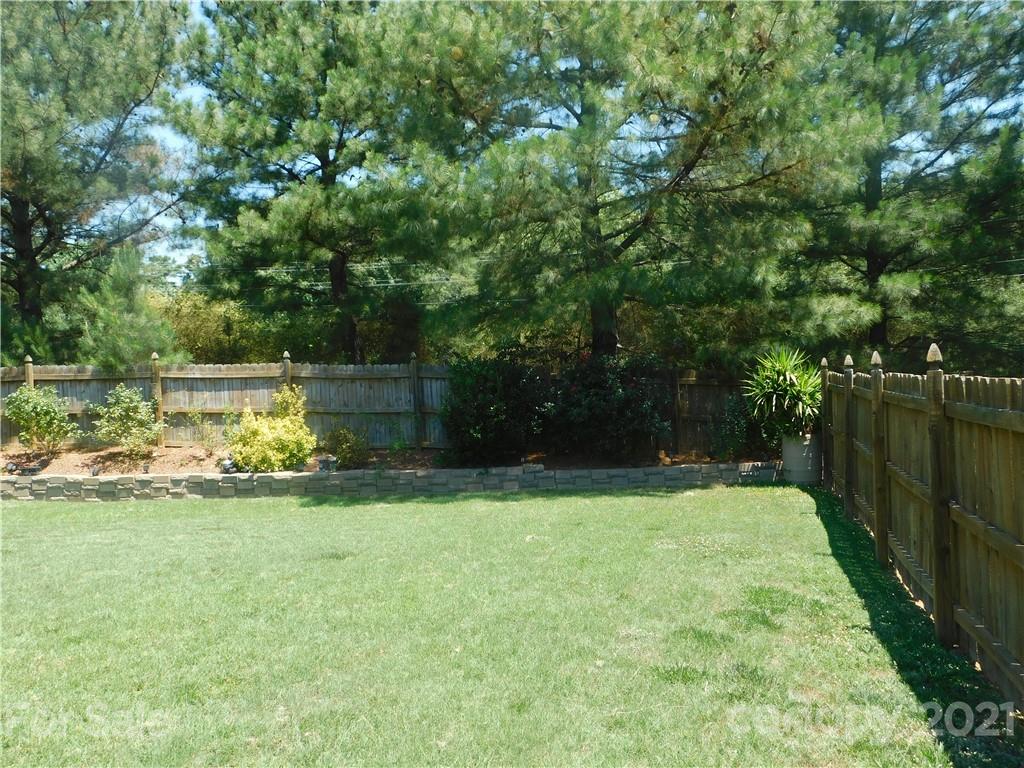 2602 Spring Breeze Way Monroe, NC 28110 - Photo 40 of 43 a view of a backyard with swimming pool