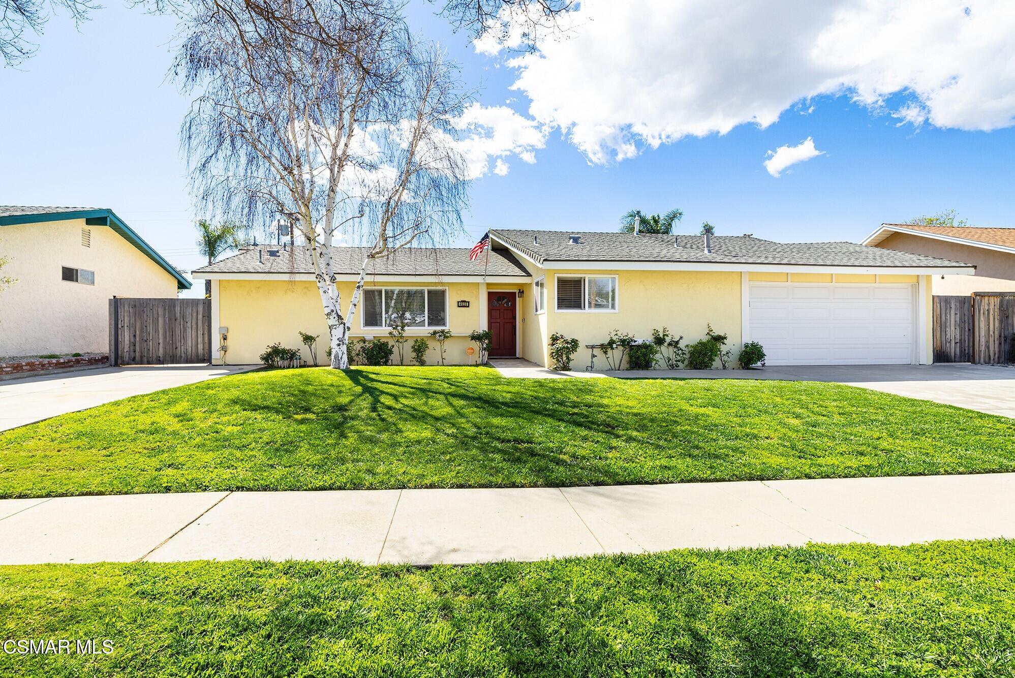 4828 Walnut Avenue Simi Valley, CA 93063 - Photo 1 of 25 a front view of a house with a garden and plants