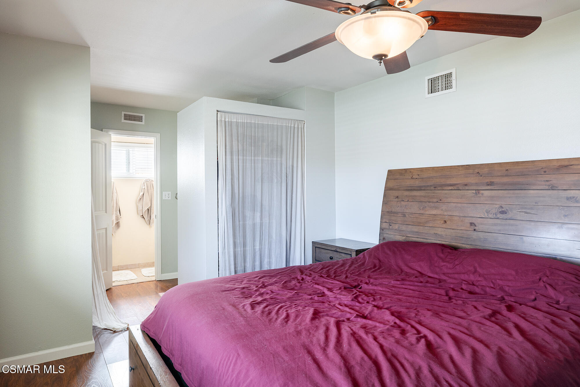 4828 Walnut Avenue Simi Valley, CA 93063 - Photo 15 of 25 a bedroom with a bed and a chandelier