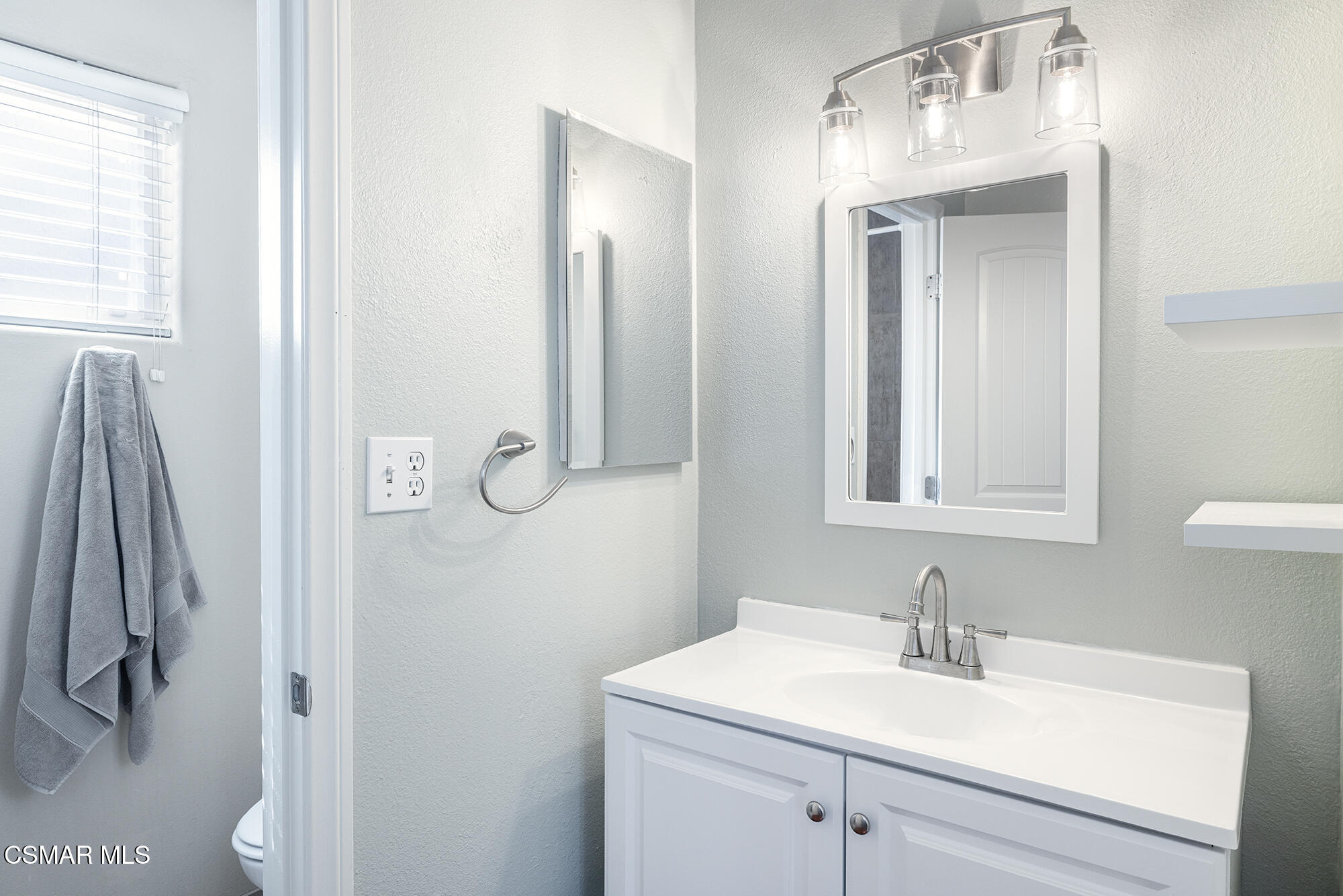 4828 Walnut Avenue Simi Valley, CA 93063 - Photo 16 of 25 a bathroom with a sink vanity and a mirror