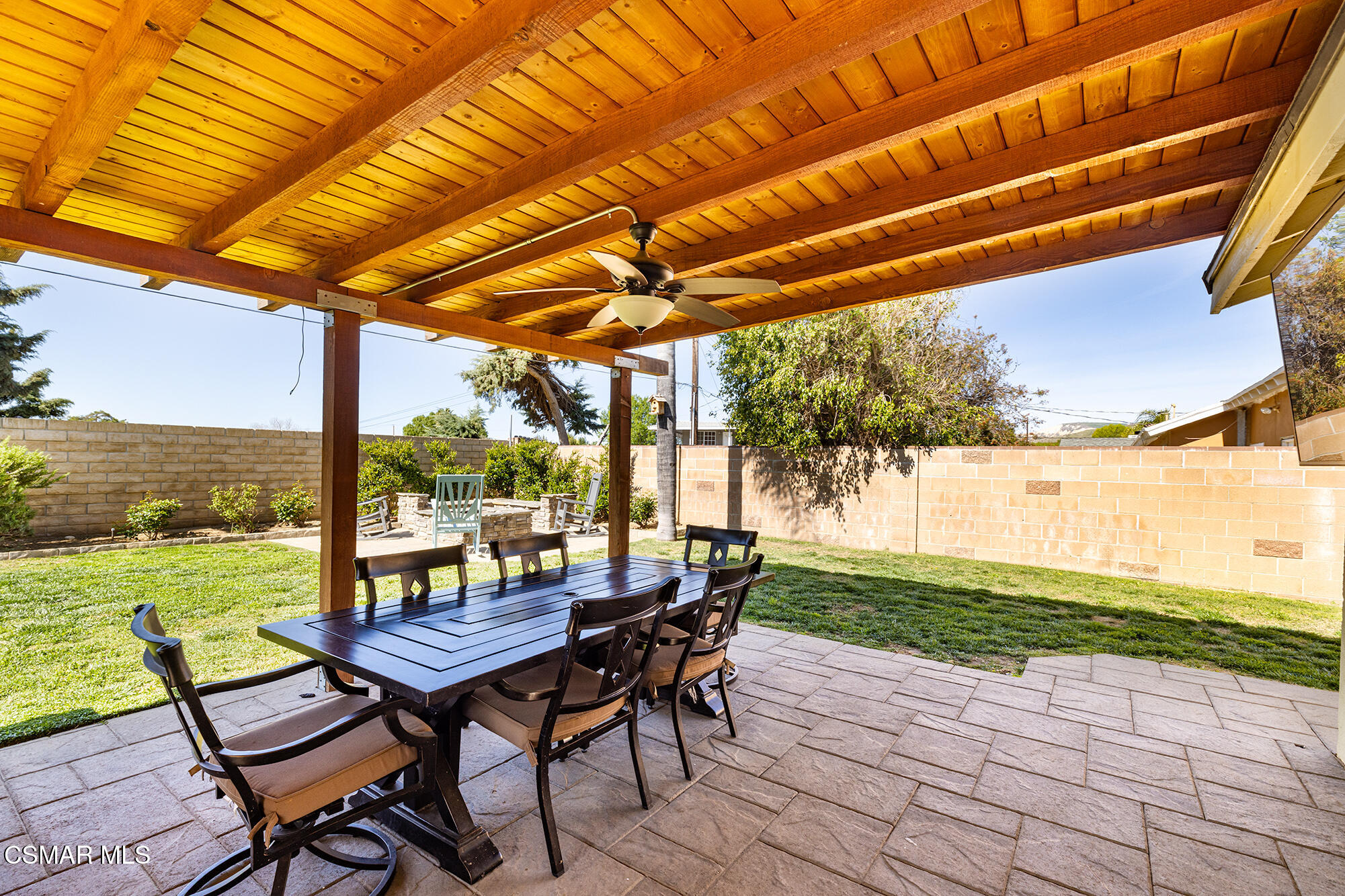 4828 Walnut Avenue Simi Valley, CA 93063 - Photo 21 of 25 a view of a patio with a table chairs and a backyard