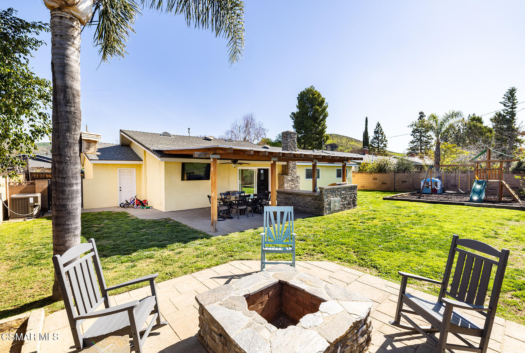 4828 Walnut Avenue Simi Valley, CA 93063 - Photo 25 of 25 a view of a patio with table and chairs potted plants and palm tree