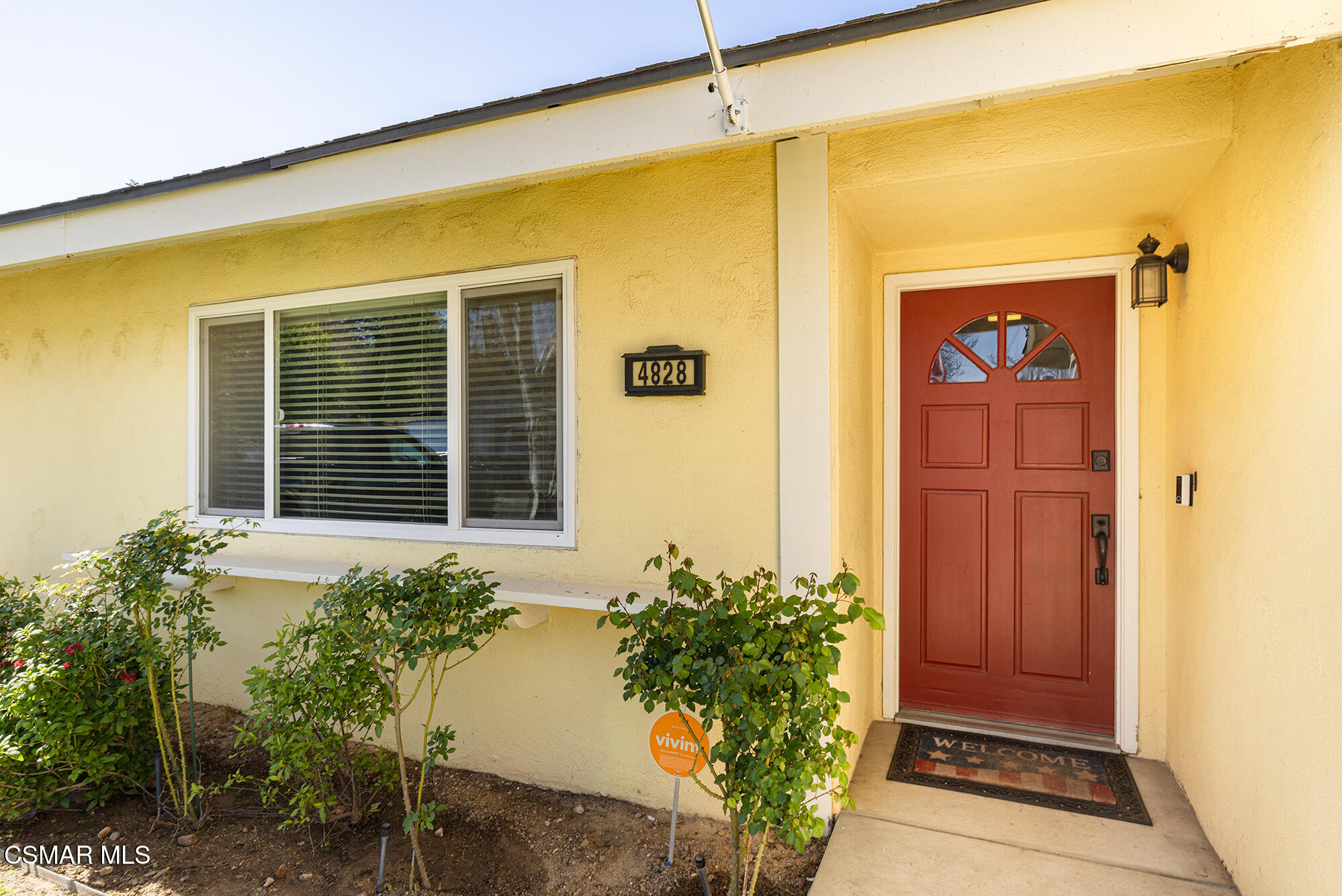 4828 Walnut Avenue Simi Valley, CA 93063 - Photo 3 of 25 a front view of a house with a yard