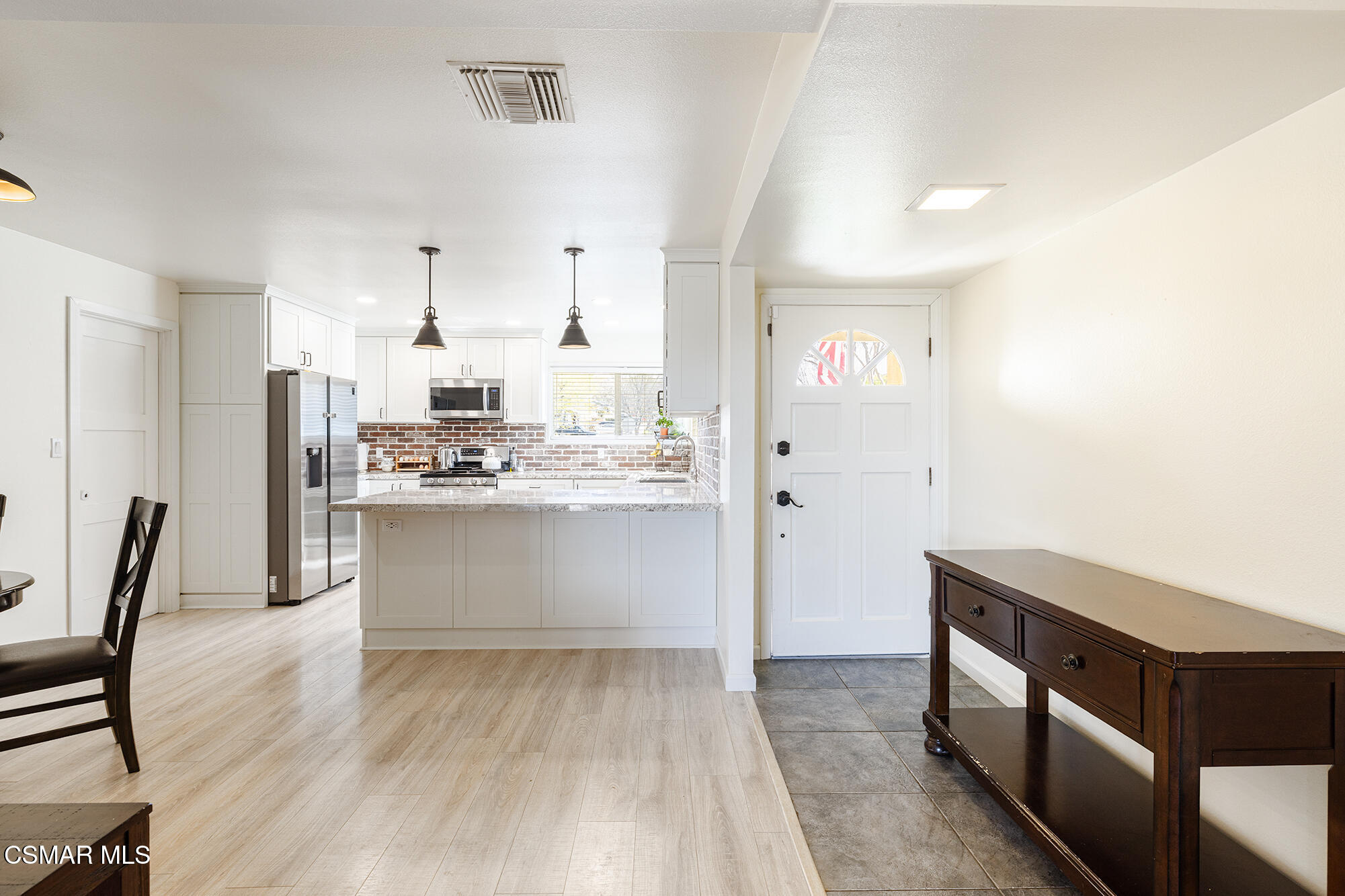 4828 Walnut Avenue Simi Valley, CA 93063 - Photo 5 of 25 a view of kitchen with wooden floor and electronic appliances