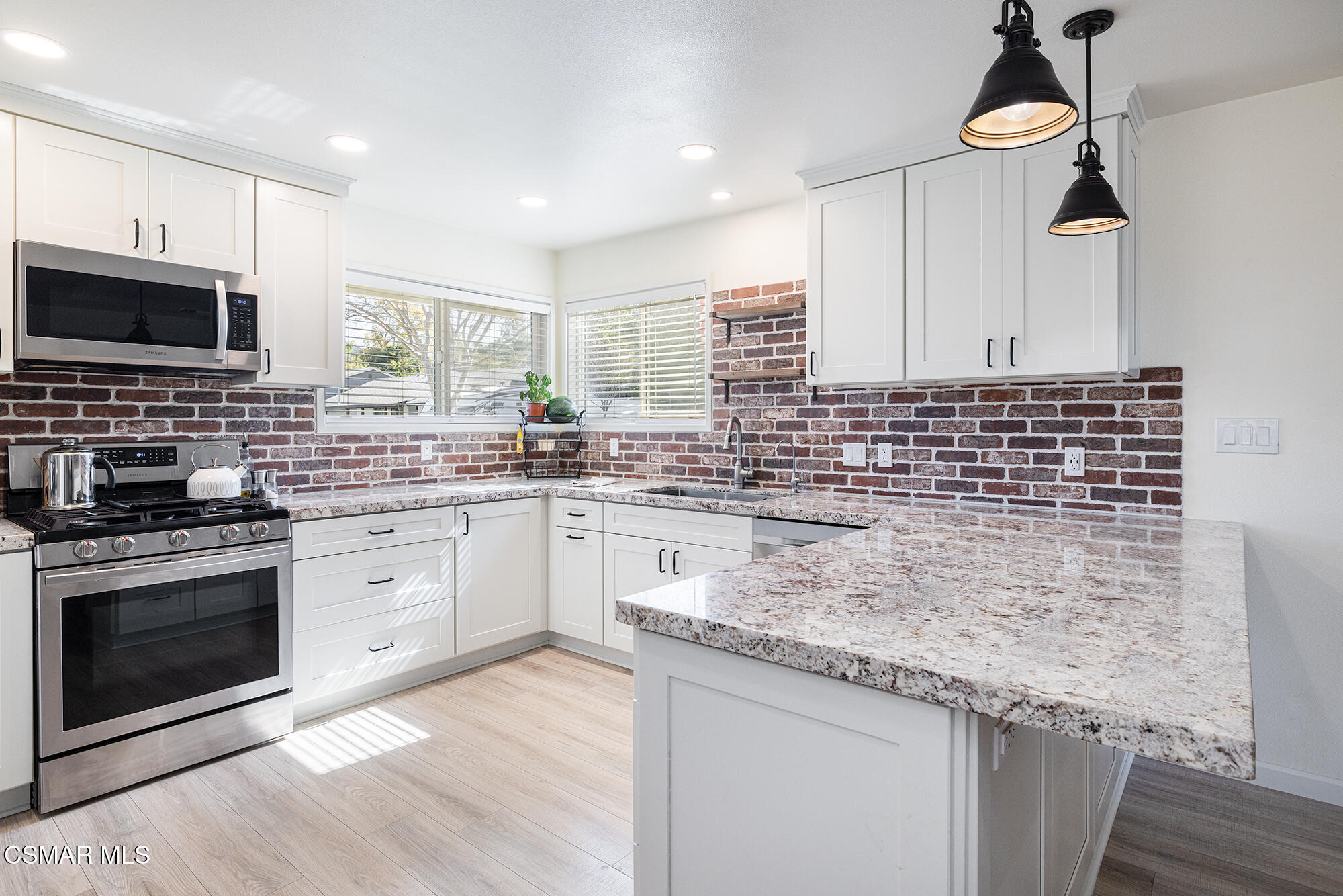 4828 Walnut Avenue Simi Valley, CA 93063 - Photo 6 of 25 a kitchen with stainless steel appliances granite countertop a sink stove and cabinets