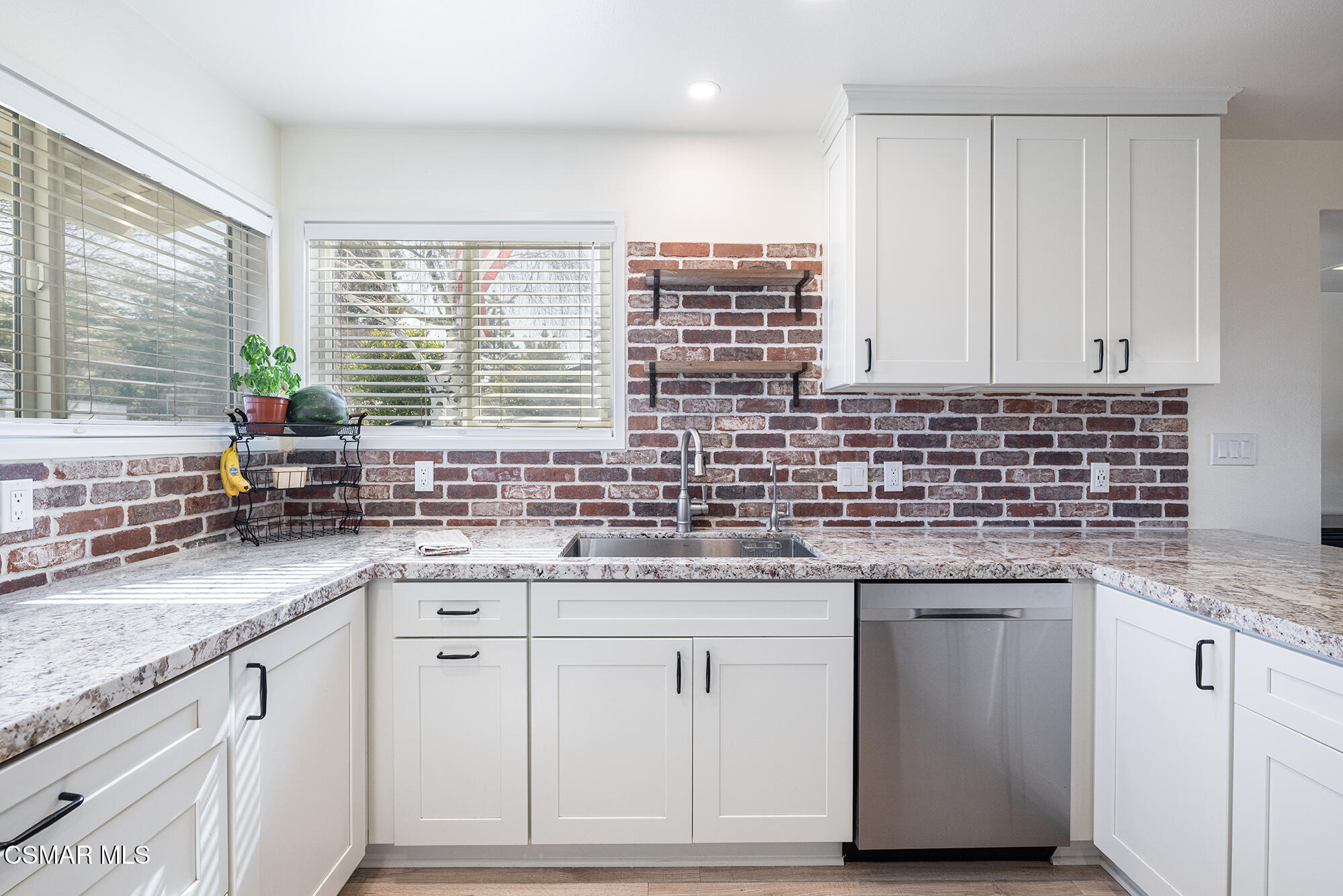 4828 Walnut Avenue Simi Valley, CA 93063 - Photo 7 of 25 a kitchen with sink cabinets and window