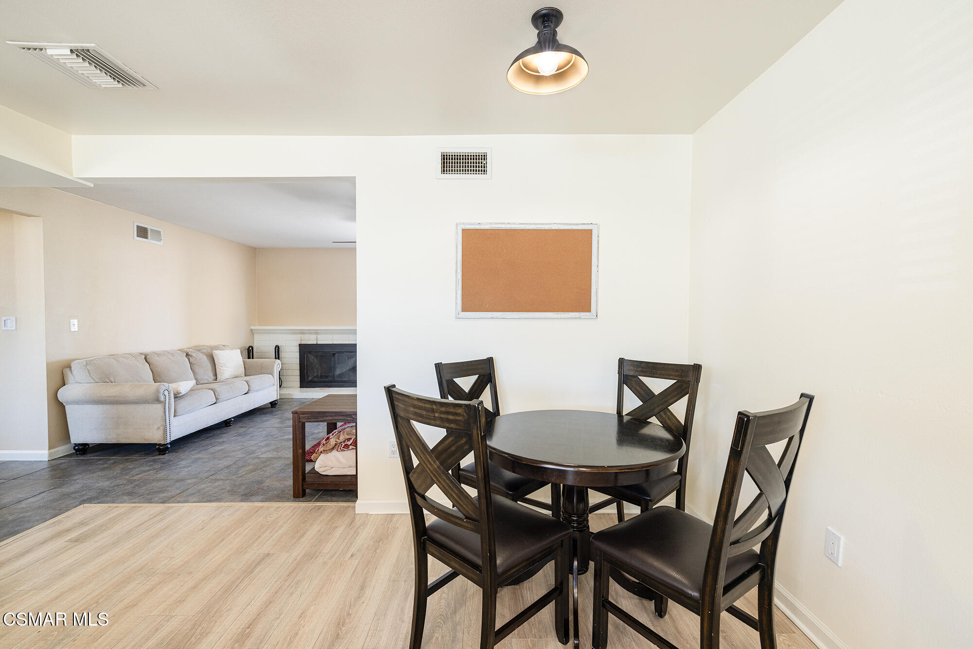 4828 Walnut Avenue Simi Valley, CA 93063 - Photo 10 of 25 a view of a dining room with furniture and wooden floor