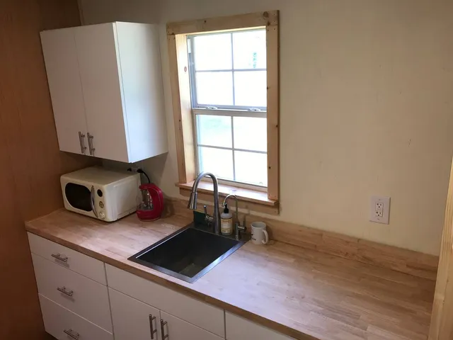 a kitchen with sink and window