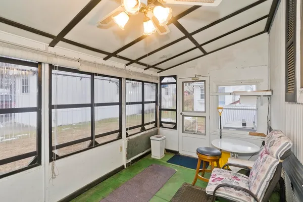 a bedroom with furniture and a window