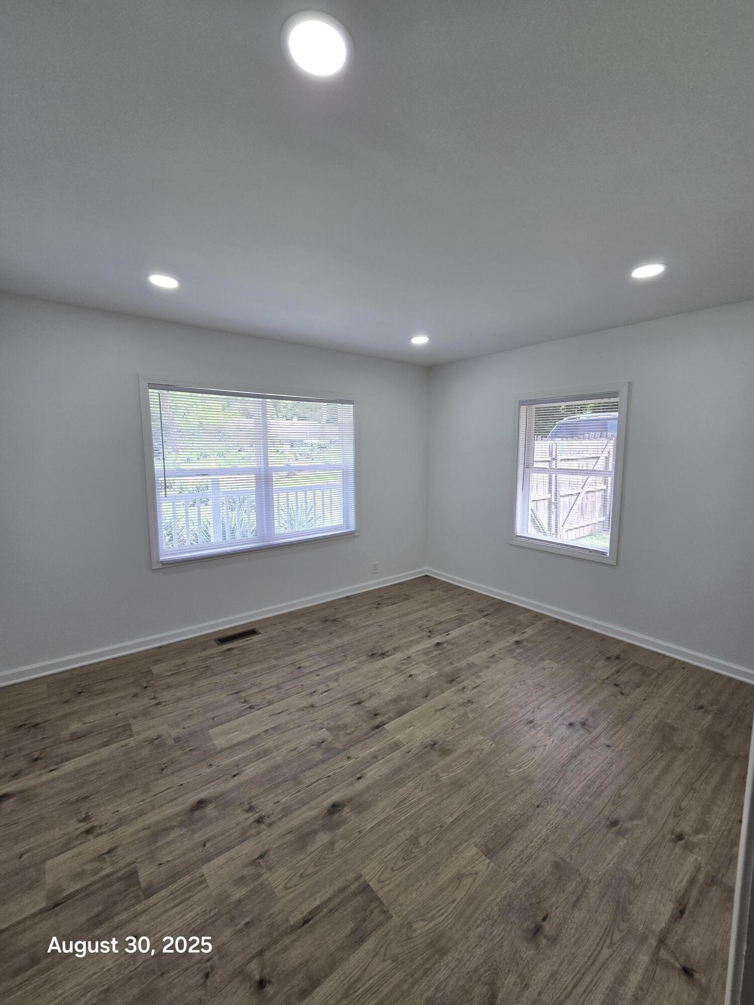 2345 Ranburn Drive Gary, IN 46408 - Photo 13 of 14 an empty room with wooden floor and windows