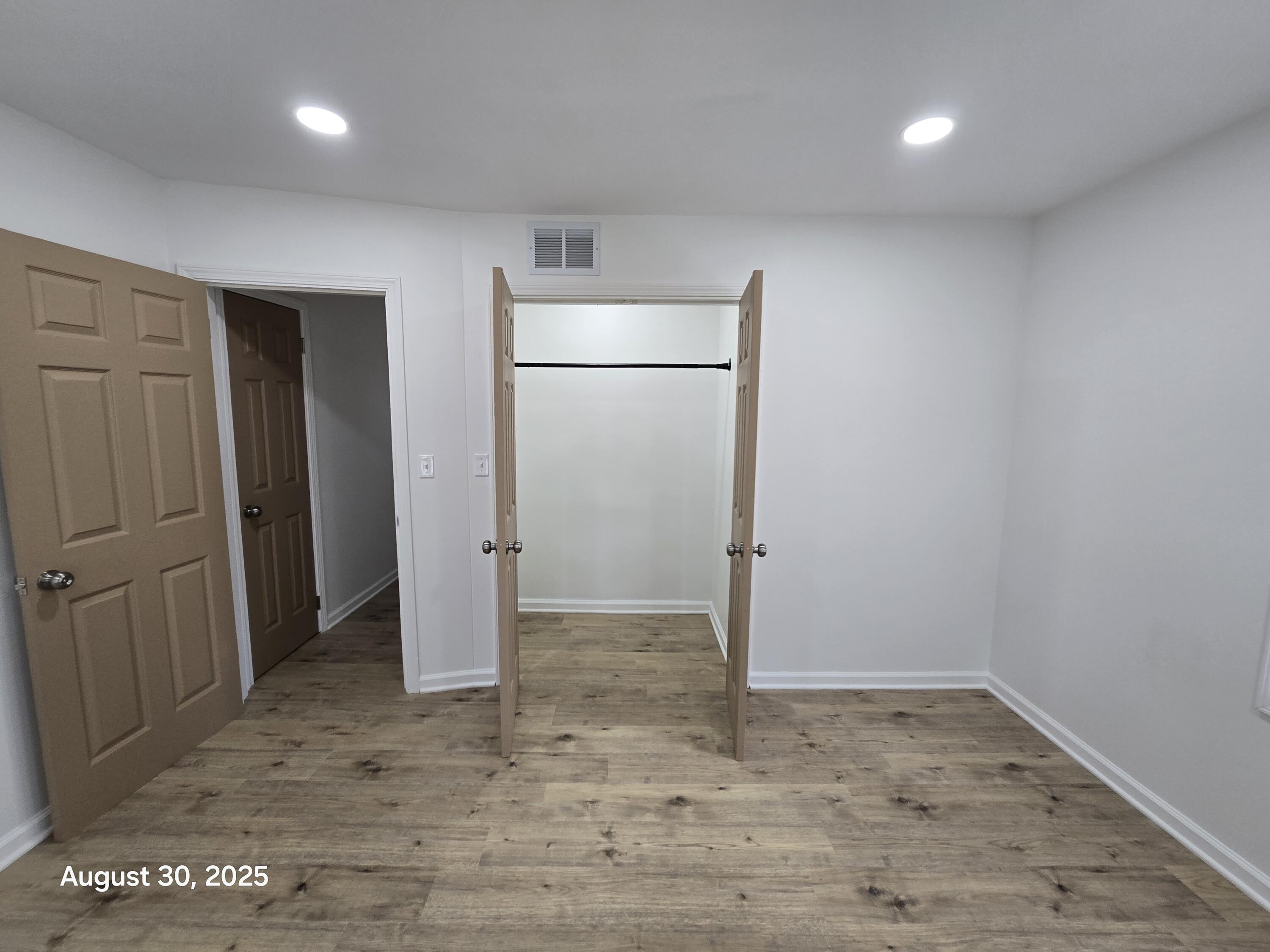 2345 Ranburn Drive Gary, IN 46408 - Photo 9 of 14 an empty room with closet and wooden floor