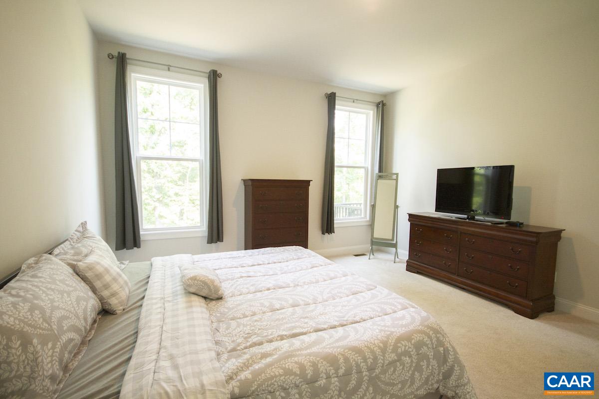 350 Claibourne Road Crozet, VA 22932 - Photo 17 of 31 a bedroom with a bed and a television