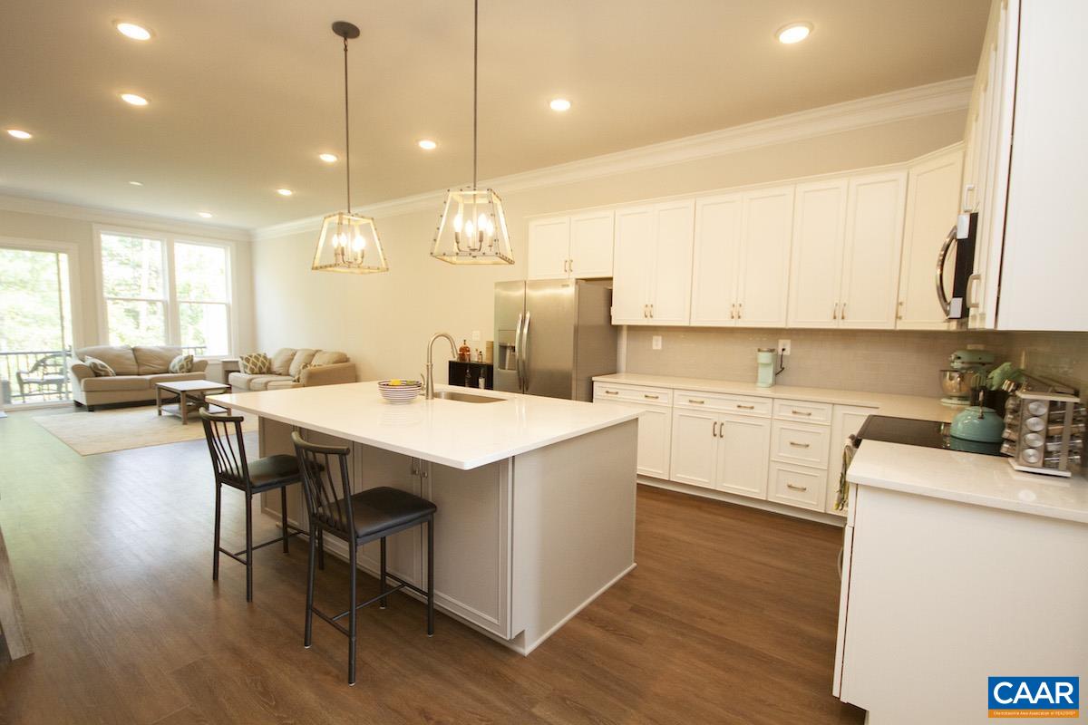350 Claibourne Road Crozet, VA 22932 - Photo 8 of 31 a kitchen with a table chairs sink and cabinets