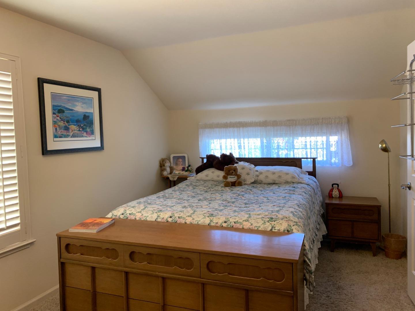 1554 Bianca Way Gilroy, CA 95020 - Photo 16 of 27 a bedroom with a bed a mirror and a window