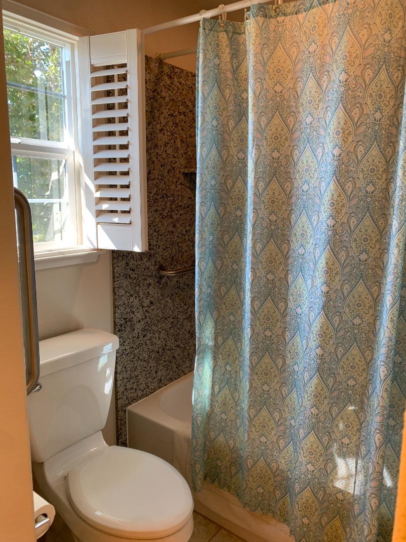 1554 Bianca Way Gilroy, CA 95020 - Photo 18 of 27 a white toilet sitting next to a bathroom sink