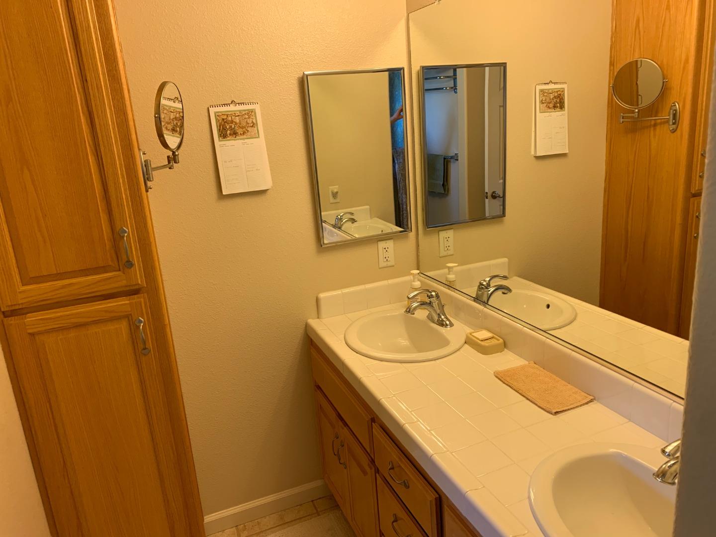 1554 Bianca Way Gilroy, CA 95020 - Photo 19 of 27 a bathroom with a sink and mirror