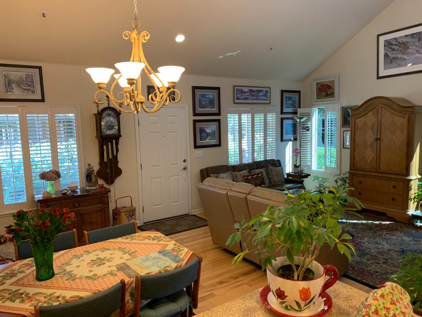 1554 Bianca Way Gilroy, CA 95020 - Photo 3 of 27 a living room with furniture dining table and a chandelier