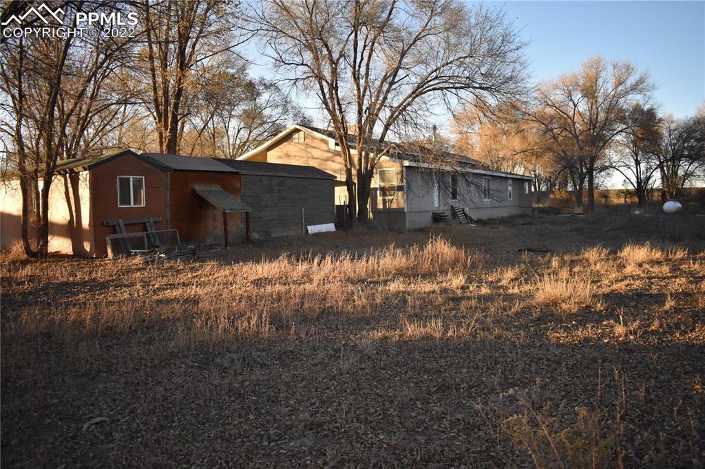 9250 County Road East Olney Springs, CO 81062 - Photo 18 of 32 a view of a yard covered in snow