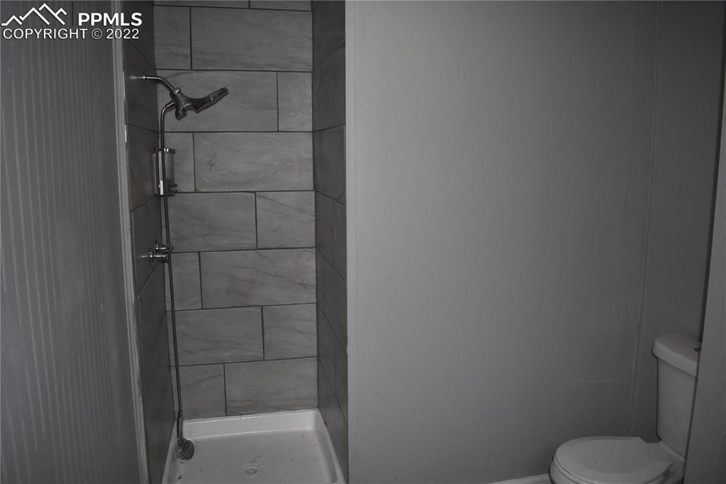 9250 County Road East Olney Springs, CO 81062 - Photo 23 of 32 a bathroom with a shower and toilet