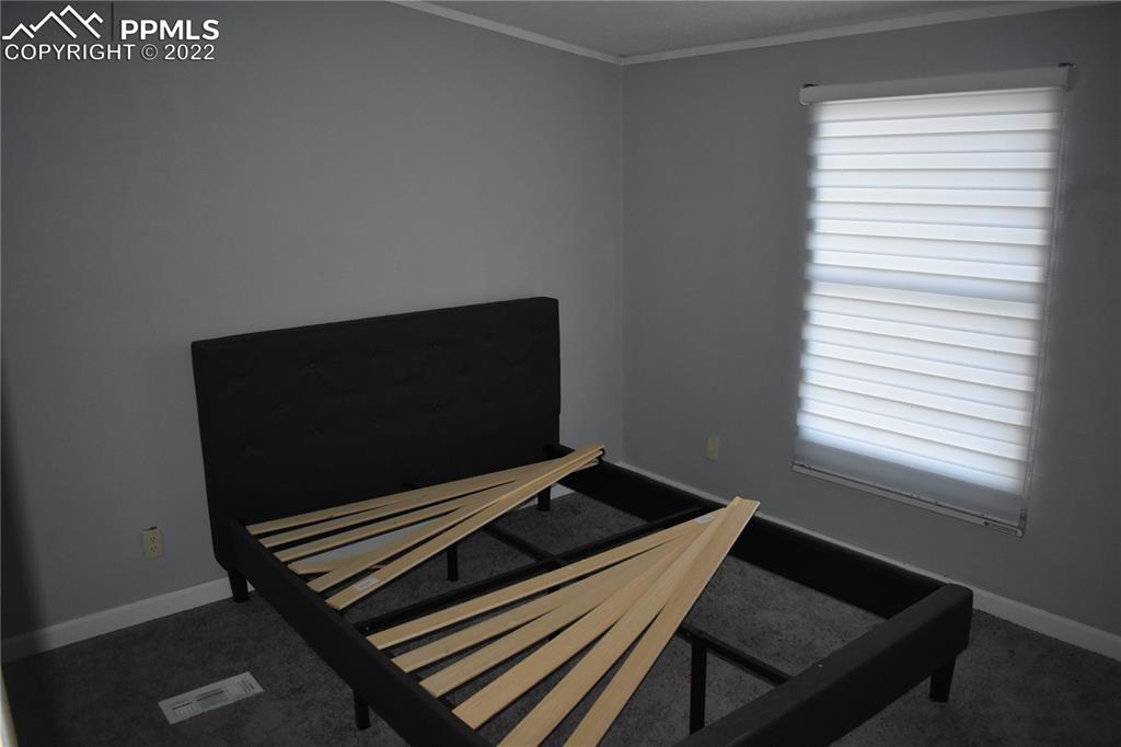 9250 County Road East Olney Springs, CO 81062 - Photo 27 of 32 a living room with chair and a window