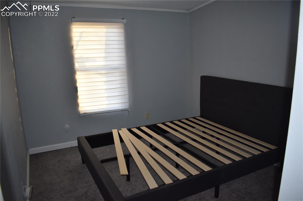 9250 County Road East Olney Springs, CO 81062 - Photo 28 of 32 a view of bedroom with wooden floor