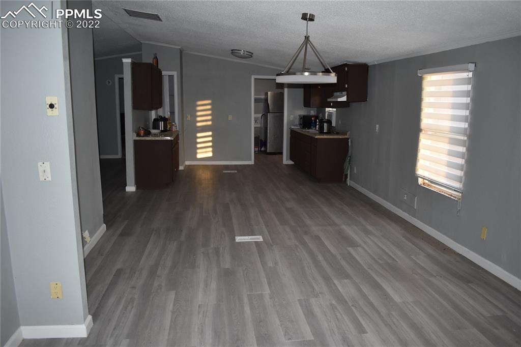 9250 County Road East Olney Springs, CO 81062 - Photo 29 of 32 a view of a kitchen cabinets and wooden floor
