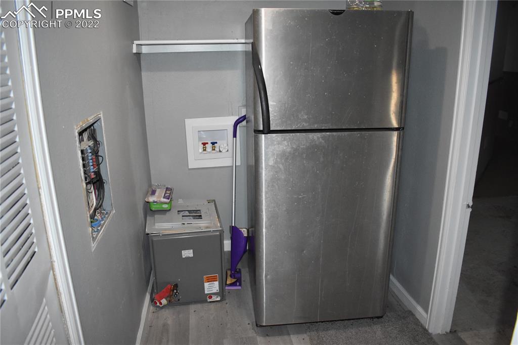 9250 County Road East Olney Springs, CO 81062 - Photo 30 of 32 a room with refrigerator and mirror